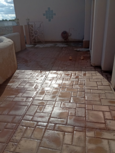 A newly installed and wet stamped concrete patio by ORG Handyman Services in Las Cruces, NM.