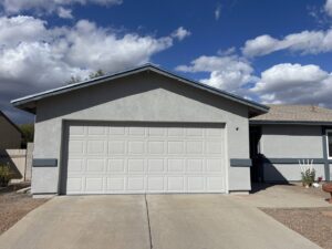 A newly finished stucco garage and house exterior by Old Pueblo Stucco, Inc. in Tucson, AZ