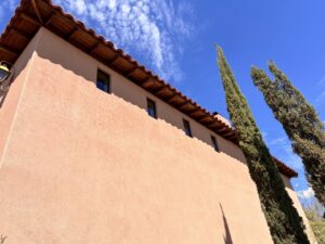 A completed stucco house exterior with a tiled roof by Old Pueblo Stucco, Inc. in Tucson, AZ