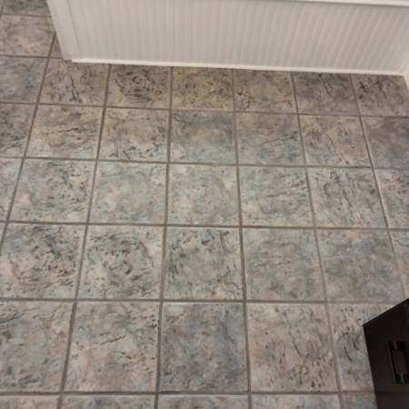 A close-up view of a finished tile floor, showcasing quality work by True Alchemy - Tile & Grout Restoration in Denver, CO.