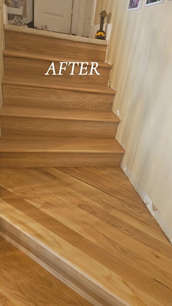 Newly finished wood stairs and adjacent flooring after a refinishing project by Quick Sand Flooring & Install LLC in Millcreek, UT.