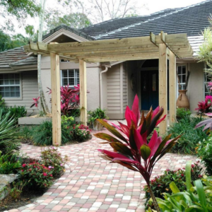 A beautifully finished wooden pergola installed by Douglas Allstott Handyman Service in Horner, WV.