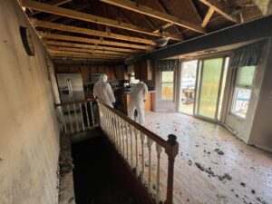 Buzz Dumpster & Junk Removal team performing a fire damage cleanout in a kitchen in Troy, MO.
