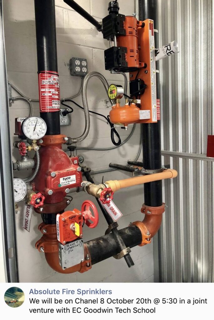 A complex fire sprinkler system riser with valves and pipes installed by Absolute Fire Sprinklers in Bristol, CT.