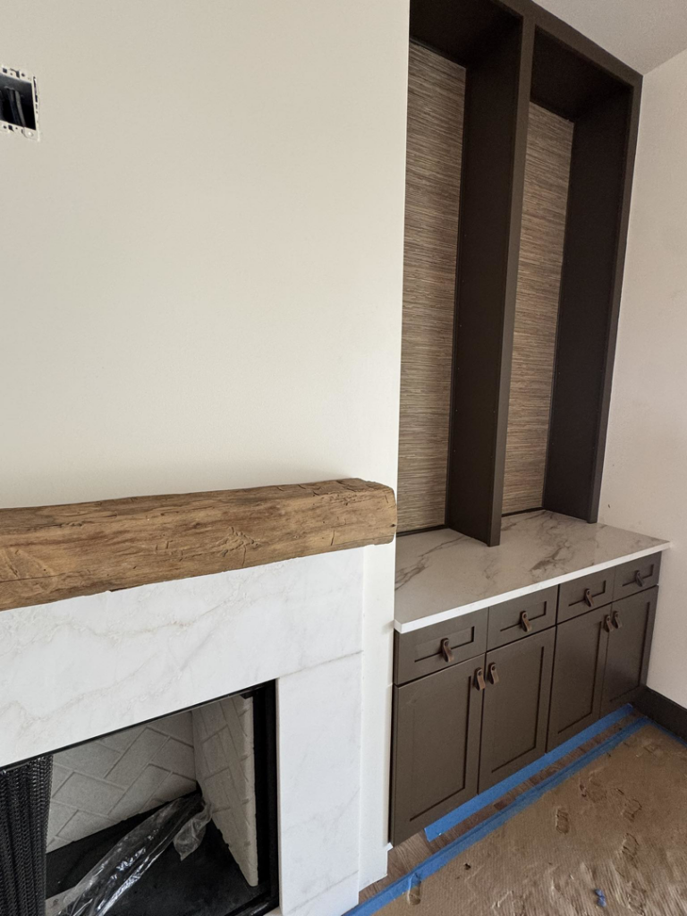 A newly installed fireplace mantel and custom built-in cabinets by DeWitt Endeavors in Lexington, KY