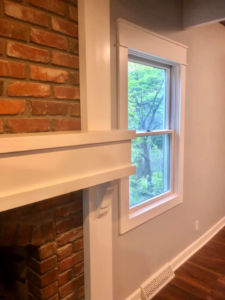 New fireplace mantel and window trim installation by EXCEL Handyman in Raytown, MO.