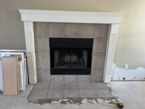 Fireplace renovation in progress with flooring removed by San Marcos Drywall and Paint in Austin, TX