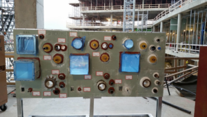 A firestopping sample board demonstrating fire-rated seals on a construction site by Bartkowski Life Safety, Corp. in Raleigh, NC.