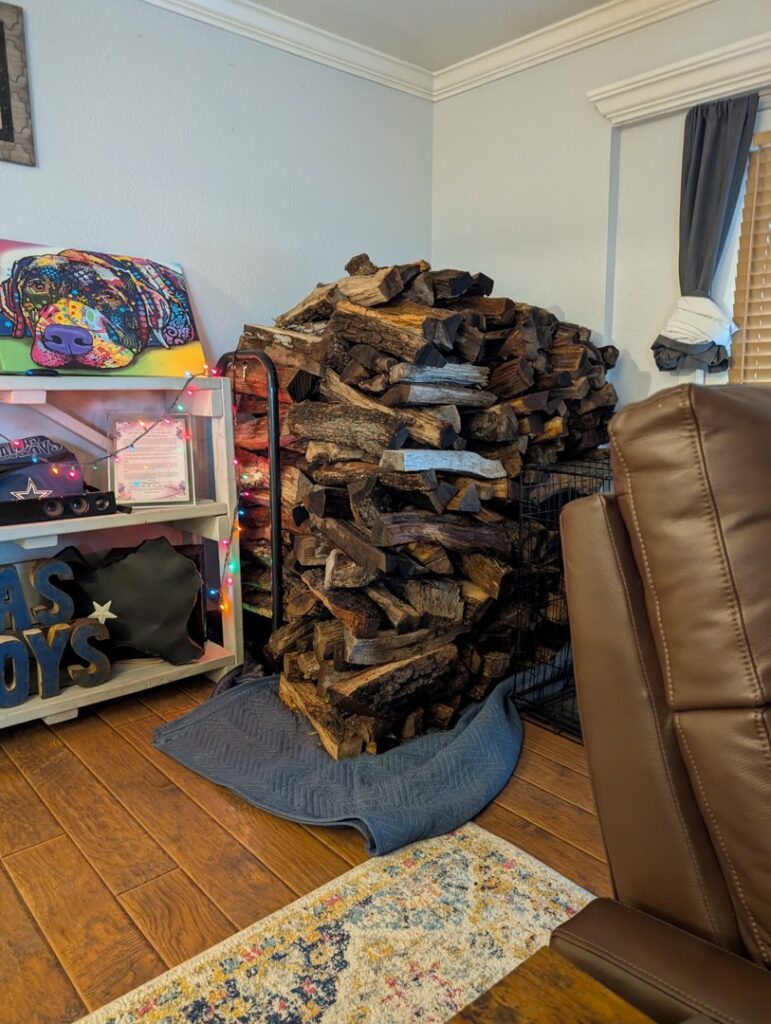 Neatly stacked firewood indoors, ready for use or delivery by Personal Touch Tree Service in Dallas, TX