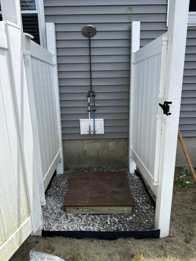 Custom floating shelves installed on a wall, holding potted plants, by Woodbine Repair & Remodeling in Jamestown, RI.
