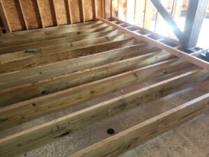 Floor joist installation for a new construction or renovation by Gladiator Flooring LLC in Summerville, SC.