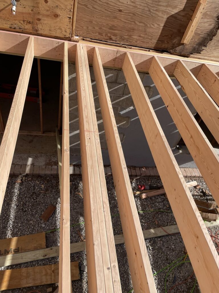 Wooden floor joists being installed during new home construction by LCM FRAMING LLC in Danbury, CT