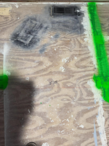 Plywood subfloor with a '28" DOOR' marking and a vent, showing renovation layout planning by Shackelford Home Designs in Loveland, OH.