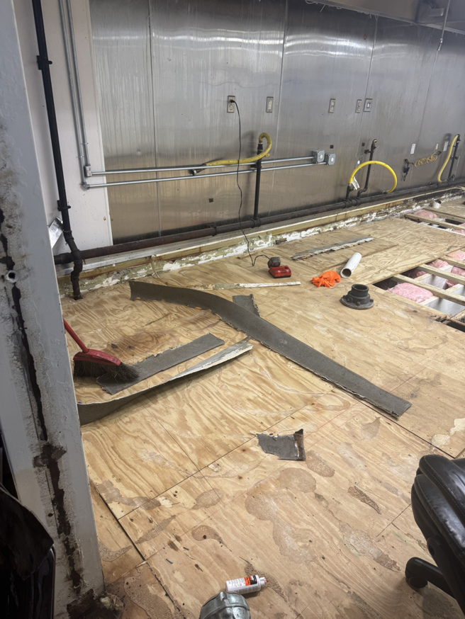 A floor removal and preparation handyman job in progress by Floorboys LLC in Lexington, SC, showing exposed subfloor and tools.