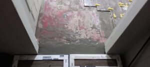 Floor tile installation in progress with mortar and spacers, demonstrating flooring services by Joel's flooring & Handyman services in Roy, UT.