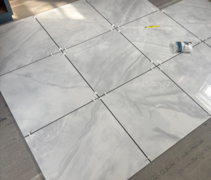 New floor tiles being installed by John Oliver Rose & Co. for a home renovation in South Bend, IN