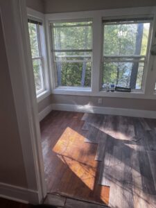 Flooring installation in progress in a room by Iron Horse Handyman Services LLC in Laramie, WY.