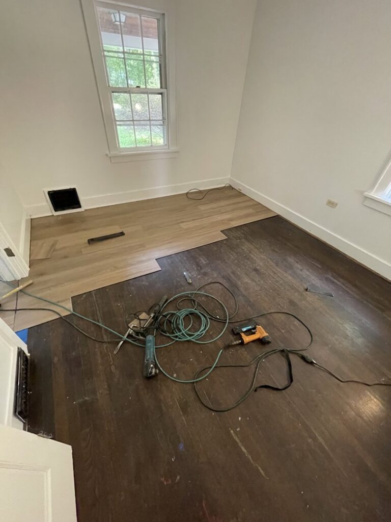 New flooring installation in progress over existing wood floors by JAC Home Improvement LLC in Danbury, CT.