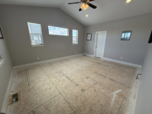 A room with subfloor exposed, showing flooring installation in progress by JJ's Handyman Service in Las Vegas, NV