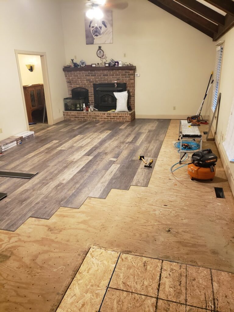 New laminate flooring installation in progress by Priority Property Services in Salisbury, MD.