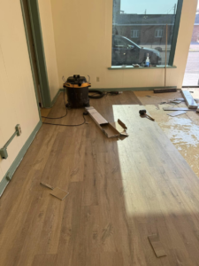 Progress of a new flooring installation project in a commercial space by Wheeler's Handyman Services in Vermillion, SD