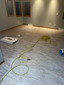 New flooring being installed in a room by S-Squared Construction in Madison, WI.