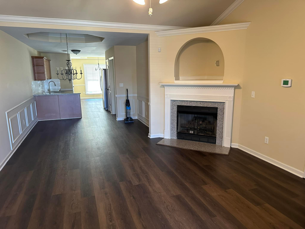 New flooring, wainscoting, and fireplace surround installed by Parker Painting Company in Edmond, OK.