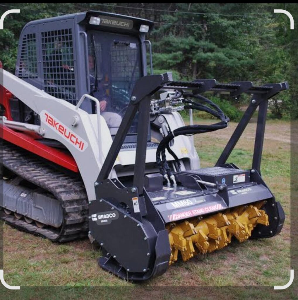 A Takeuchi compact track loader equipped with a forestry mulcher for land clearing and stump grinding by A New Image Property Maintenance in Olive Branch, MS.