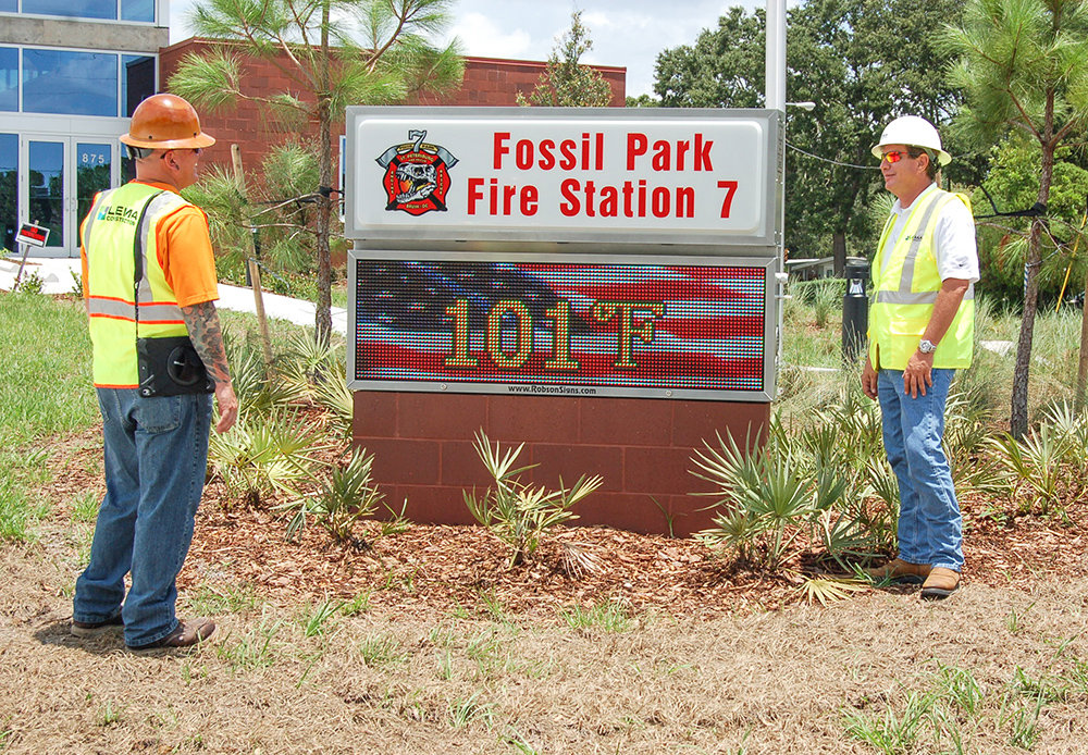 Construction workers at the completed Fossil Park Fire Station 7 project by LEMA Construction, Inc. in Saint Petersburg, FL.
