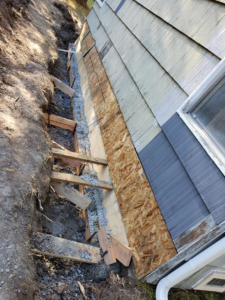 Fresh concrete poured into forms for a house foundation repair by KB Construction NW, Inc. in Springfield, OR.