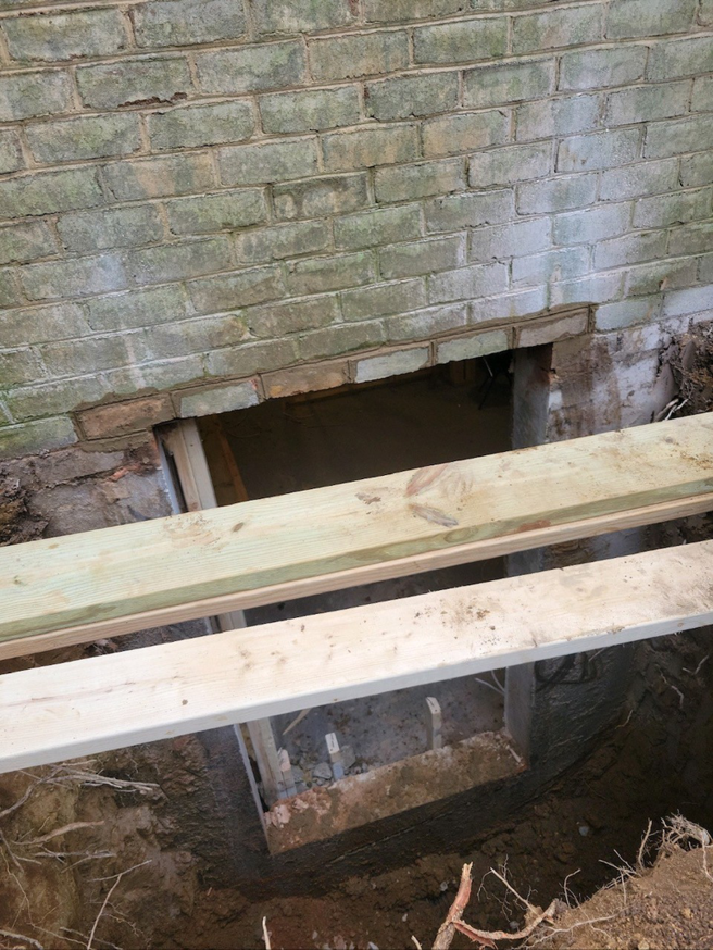 A foundation opening or crawl space access under construction by JDS Home Improvement in Gaithersburg, MD.