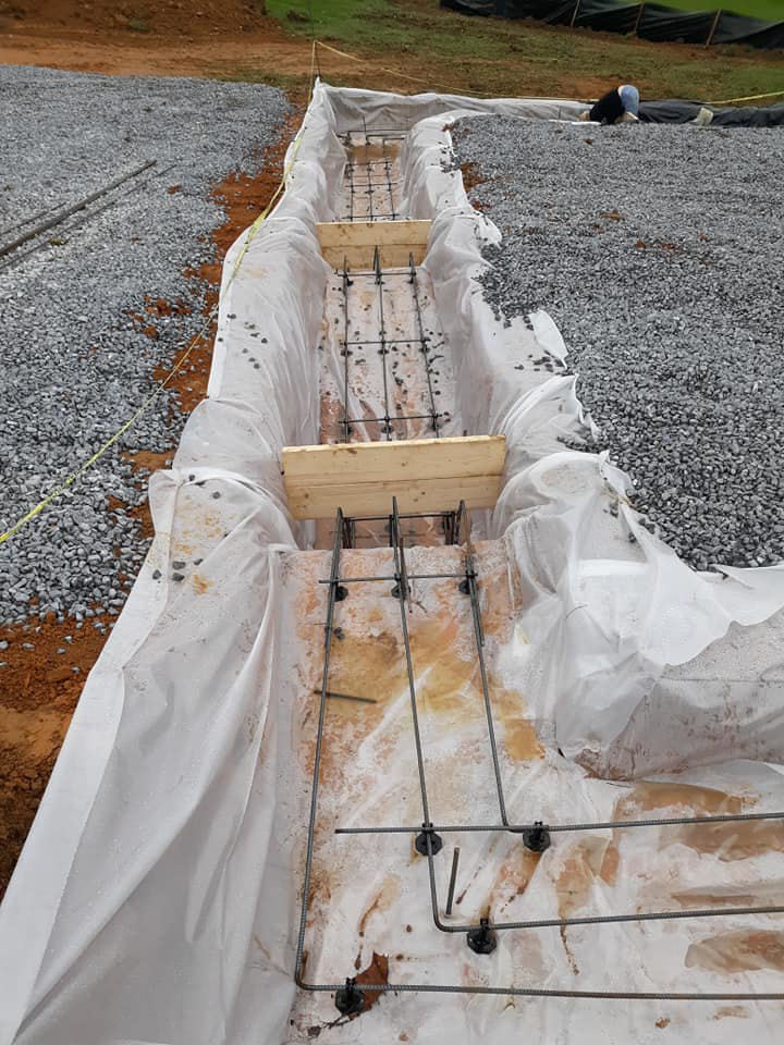 Rebar and plastic sheeting installed for a new foundation by B & L Builders in Jonesborough, TN