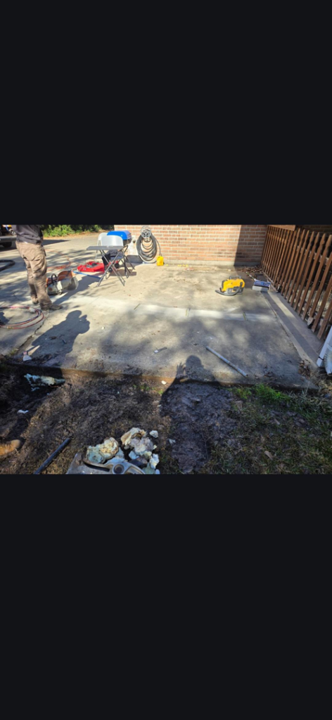 Foundation repair work in progress with equipment at Gulf Coast Foundation Solutions in Lafayette, LA