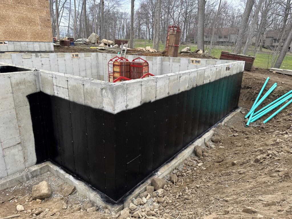 Foundation waterproofing with drainage pipes installed by ProSeal Waterproofing in Naugatuck, CT.