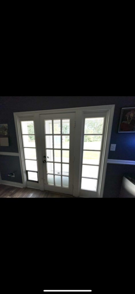 Interior view of French doors with a newly installed pet door, showcasing handyman services by CNG Contracting Group in Richmond, VA