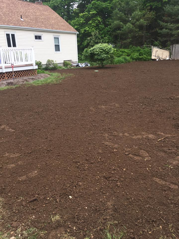 Freshly graded soil for new lawn preparation by Us General, Inc. in Brockton, MA.