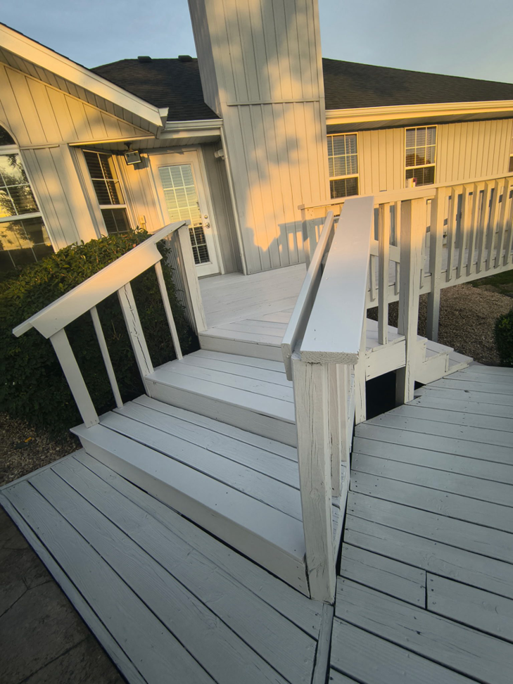 A freshly painted wooden deck and stairs completed by Stone Valley System's Handyman in Springfield, MO.