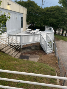 A freshly painted outdoor deck, showcasing quality handyman work by Star Mountain Realty LLC in Roanoke, VA.