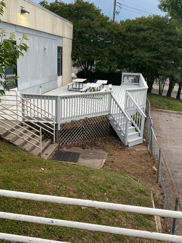 A freshly painted outdoor deck, showcasing quality handyman work by Star Mountain Realty LLC in Roanoke, VA.