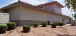 A freshly painted white brick house exterior completed by Paint Co in Canyon Lake, CA