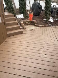 A freshly painted wooden deck with steps, completed by Joe's Handyman Solutions in Ogden, UT.