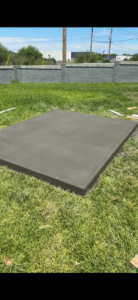 A freshly poured concrete slab in a backyard by Camacho's Construction LLC in Laredo, TX.