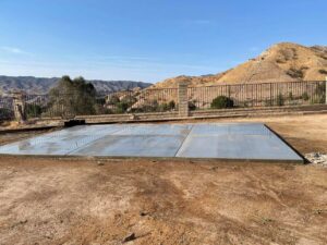 A freshly poured concrete slab in a backyard, ready for use, by Sal Handyman Services in Canyon Country, CA