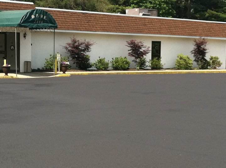 A freshly sealcoated asphalt parking lot completed by Empire Sealcoating in Albany, NY