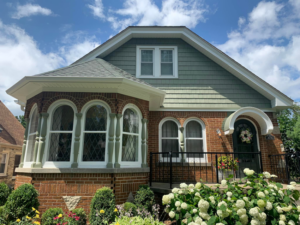 Front exterior renovation with new siding and brickwork by Sockett Siding, LLC in Milwaukee, WI