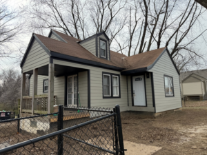 Front exterior of a house showcasing new siding and windows by Kansas City Siding and Windows in Kansas City, MO.