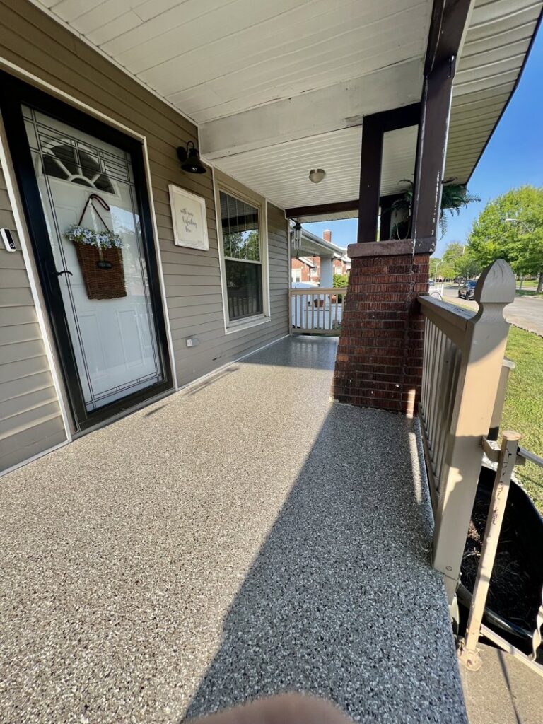 A welcoming front porch with a fresh, durable floor coating applied by Egli Coating Solutions handyman in Evansville, IN.