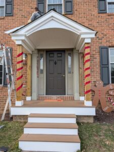 Front porch renovation in progress on a brick house by Adam's Handyman and Contracting in Lancaster, PA.