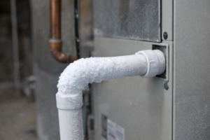 A frozen pipe on an HVAC system, indicating a plumbing or heating repair needed from Gartman Mechanical Services inc. in Oshkosh, WI.