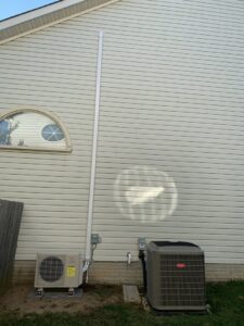 An outdoor Fujitsu mini-split and Bryant AC unit installed at a home by Cold Comfort HVAC Services, LLC in Rockville, MD.